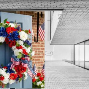 Large red white and blue patriotic wreath hanging on a front door for 4th of July and Independence Day home decorations.